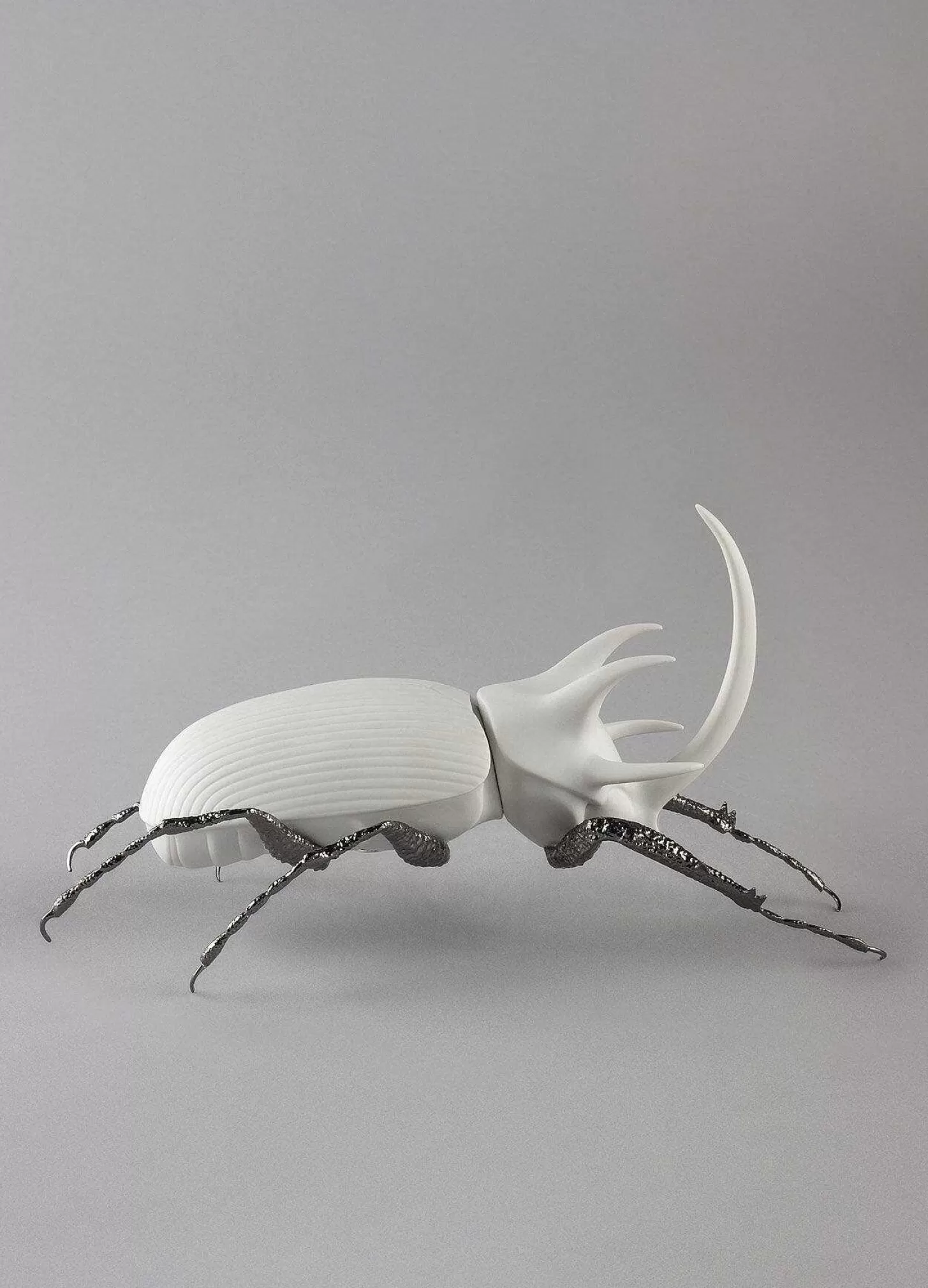 Lladró Rhinoceros Beetle Figurine. Matte White^ Design